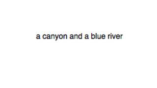 a canyon and a blue river
