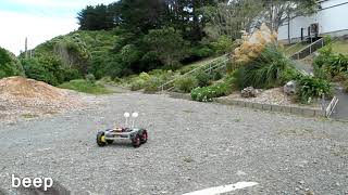 ButtBot plays in gravel and sawdust.