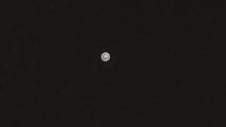 Large Glowing UFO Sphere Slowly Hovers, Then Disappears.