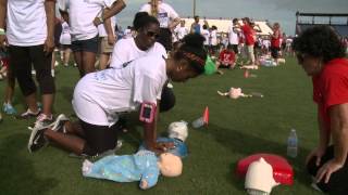 Record-setting 5000 people learning CPR in a stadium field.