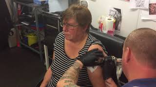Zoe Murr, secretary at Newark Flowserve FC, has club badge tattoed at Corner 11 Tattoo Studio