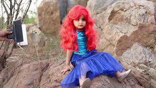 kid model anya posing for disney calender shoot as ariel ( little mermaid )