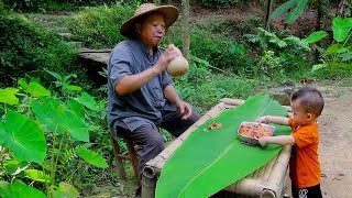 An old man in a remote mountain village uses clay to make an oven, and a stove for roasting shrimp