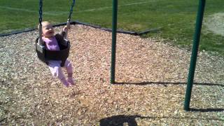 abigail at the park first time swinging