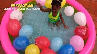 Alikah the toddler learns the colors with balloons in the pool