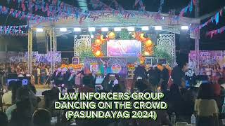 LAW ENFORCERS GROUP DANCING ON THE CROWD...