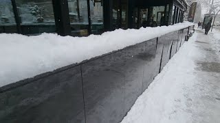 Removing Block Of Snow From Marbel Stone Wall