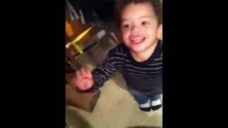 Funny 2 year old feeding the cat LOL