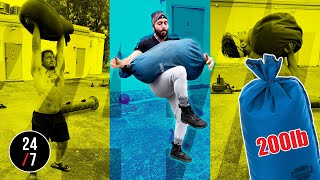 TRYING TO OVERHEAD PRESS A 200lb SANDBAG | Strongman Training