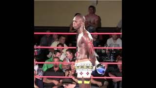 Israel Adesanya stood staring is opponent down between rounds