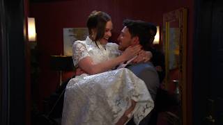 Alex carries Stephanie over the threshold