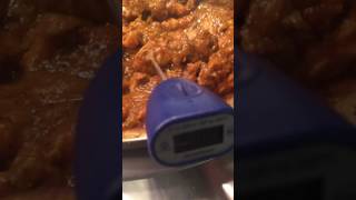 Testing temperature of chicken curry in a CookTek Sin Aqua food warmer [HD]