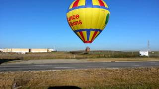 Sundancehot hot air balloon gets pulled over fence SE Calgary 52 St