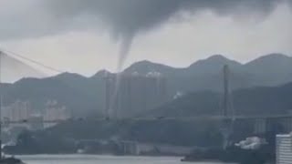 Water spout sweeps Hong Kong beach