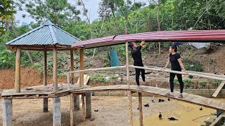 Two sisters made the roof and railing of the bridge together