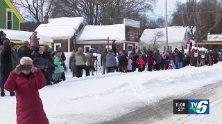 UP200 volunteers and fans celebrate midpoint of the race in Grand Marais
